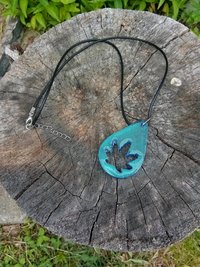 Resin teardrop cannabis leaf pendant black cord