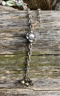 Nature themed beaded necklace with charms and  flower accents