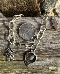 Silver chainlink charm bracelet with grateful dead charms