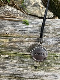 Grateful Dead  13 point lightning bolt  with beautiful stamped pendant that has the word "Grateful" embossed 