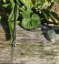 River Glass Necklace   River polished antique glass on   black cotton cord