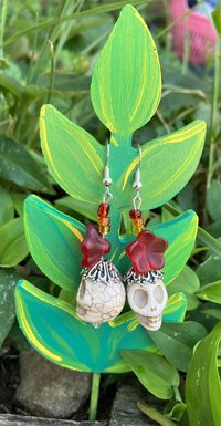 White Skull bead with a metal bead cap glass flower 