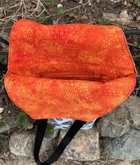 Handmade coffin bag by Lucky Burrito Moth and beetle fabric and orange batik circle liner