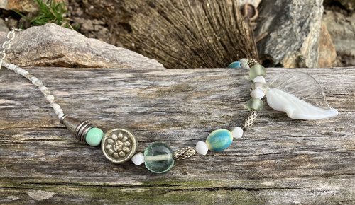 Nature themed beaded necklace with charms and  flower accents