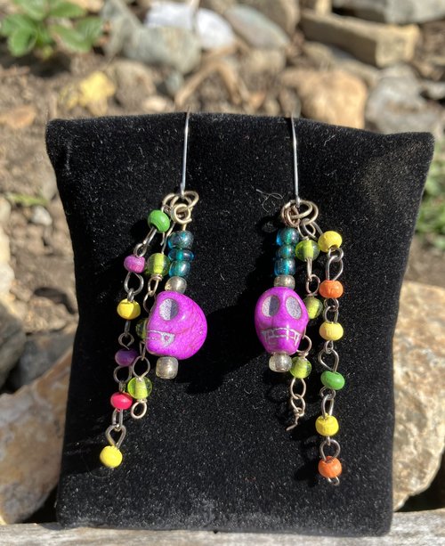 purple voodoo skulls with various wooden and glass beaded fish hook earrings