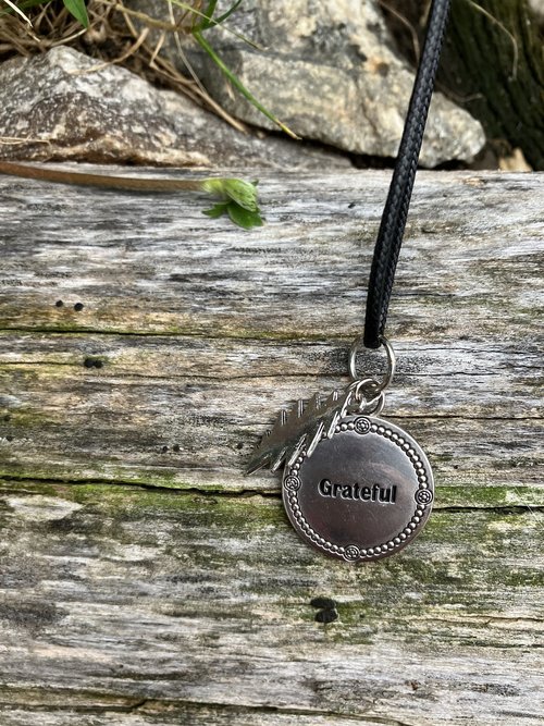 Grateful Dead  13 point lightning bolt  with beautiful stamped pendant that has the word "Grateful" embossed 