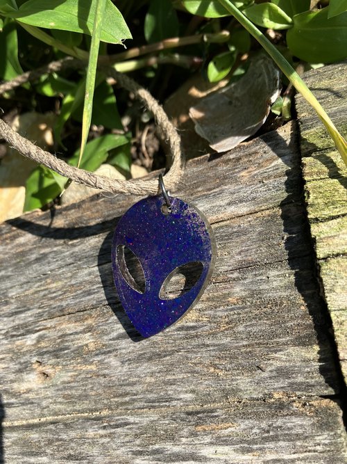 moby purple Alien resin pendant on  hemp cord 