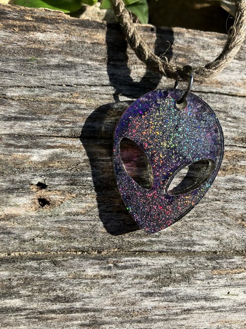 moby purple Alien resin pendant on  hemp cord 