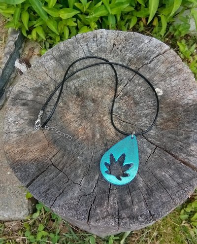 Resin teardrop cannabis leaf pendant black cord