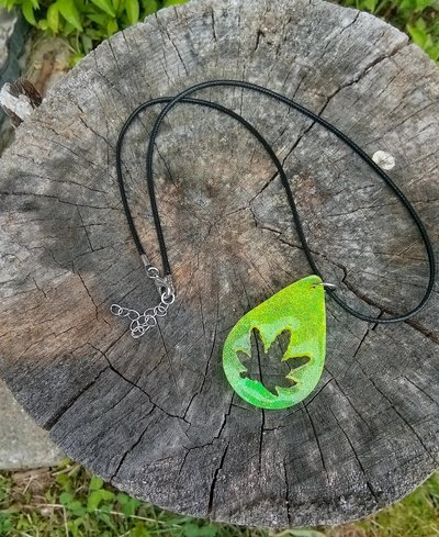 Resin teardrop cannabis leaf pendant black cord
