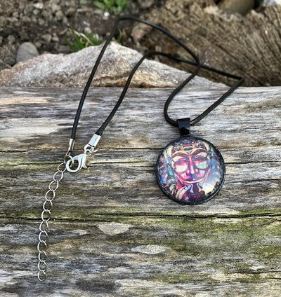 multi colored  anon mask / commander X glass and metal pendant on black  cotton cord