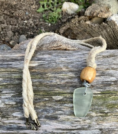 River Glass Necklace  silver wrapped   river glass on  wooden bead  Hemp