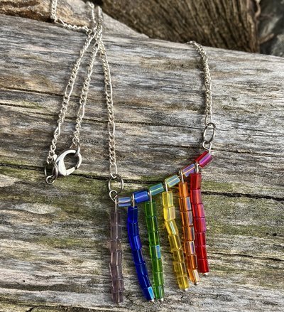 Glass beaded necklace with rainbow dangling beads