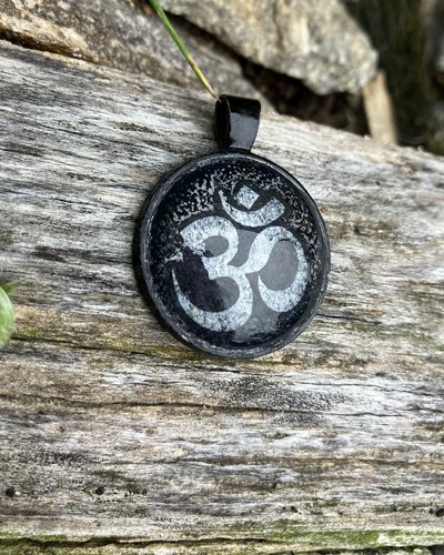  om glass and metal pendant