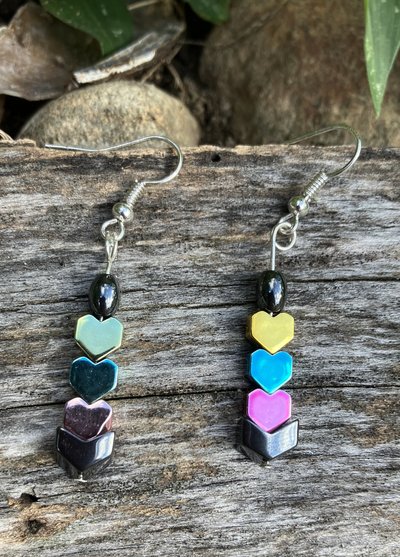 Chevron with pink blue and yellow descending topped with an oval hematite hearts fish hook earrings 