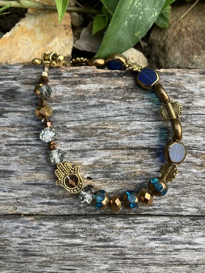 Hand beaded Bracelet  hand of Fatima charm with crystal and two tone crystals and glass with gold colored suns 