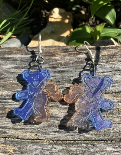 Grateful Dead  dancing bear resin with varying colors purple to  golden orange in shifting hues of  mica glitter 
