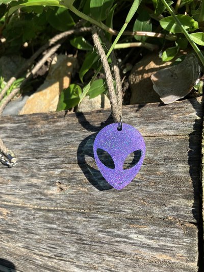 trap purple Alien resin pendant on  hemp cord 
